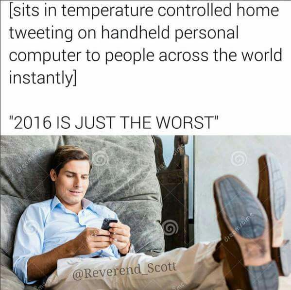 Computer - sits in temperature controlled home tweeting on handheld personal computer to people across the world instantly "2016 Is Just The Worst" dreamstime