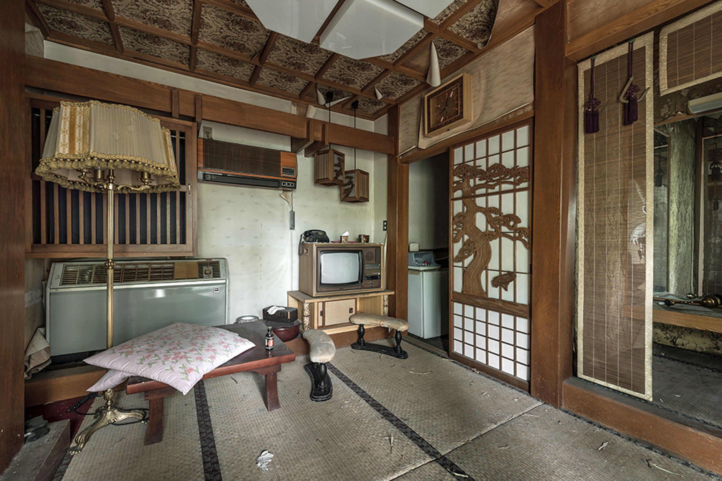 Pictured, a room modeled to look like a traditional Japanese Roykan. The style is characterised by straw mats, panelling, and low tables. A Roykan is a 17th century inn, where travellers could stop for the night and rest.