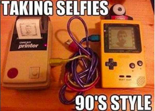 Meme of someone taking a selfie using a modified gameboy and portable printer and a bunch of wires.