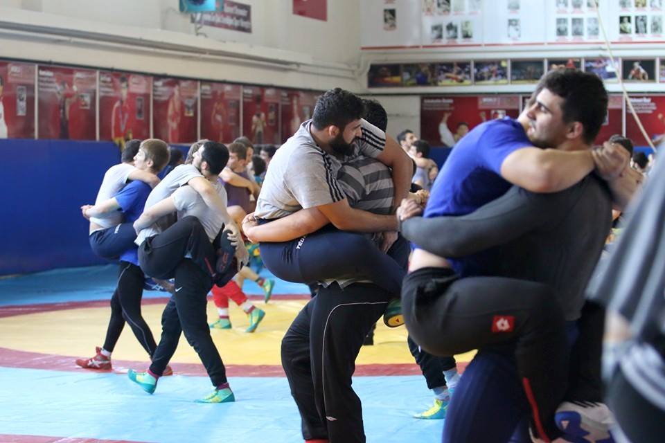 Self defense course pic taken right at the right time of all the men leg hugging their partners.