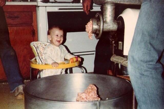 kid laughing at the meat grinder pooping out fresh meat