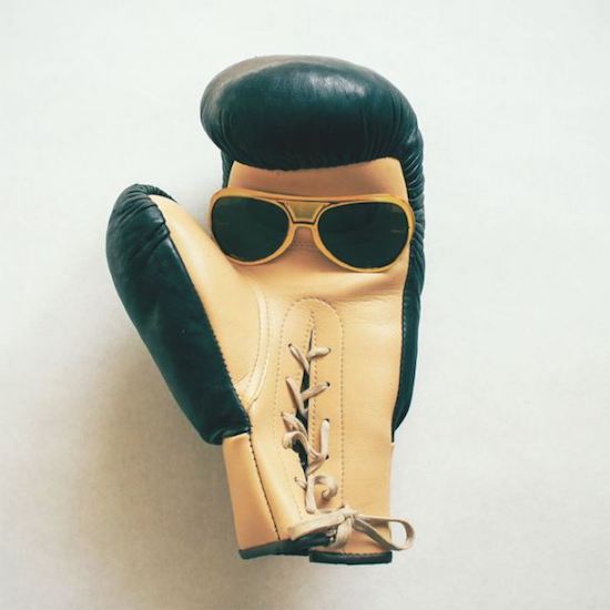 Boxing gloves with sunglasses that look like Elvis Prestely.