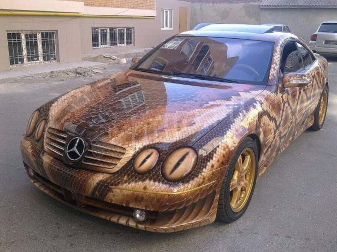 Detailed paint job on a Mercedes that makes the car appear to be a snake.