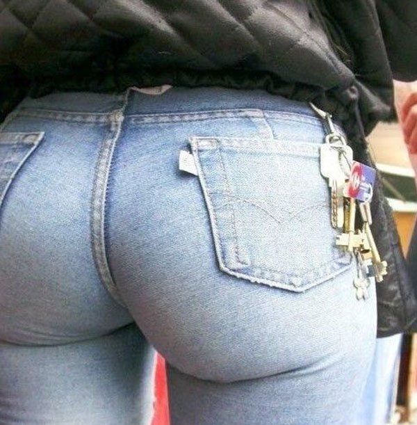 Woman with bubble butt in tight jeans and a pair of keys affixed to one of the belt loops.
