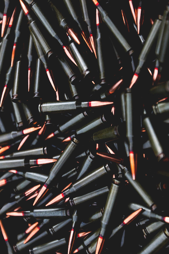 Black bullet casings with copper tipped projectiles