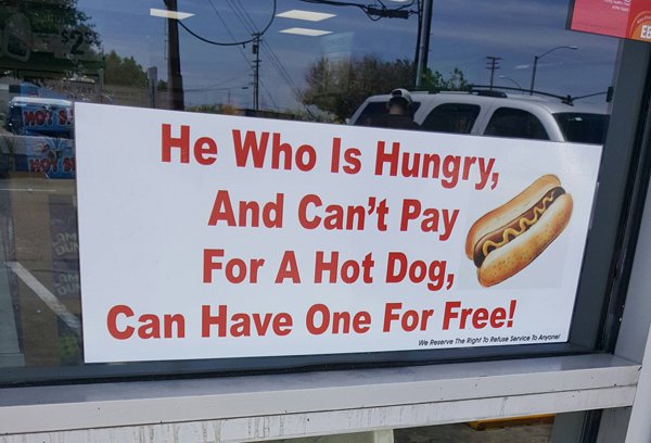 Photograph - He Who Is Hungry, And Can't Pay For A Hot Dog, Can Have One For Free! We Peserve the right f or Service Aron