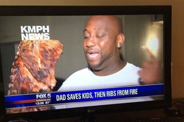 Picture of the TV of a Dad who ran into fire to save his kids, then ran back in to get the ribs.