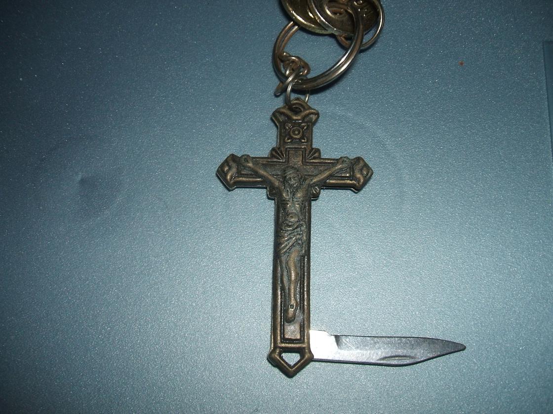 Cross with a folding knife.