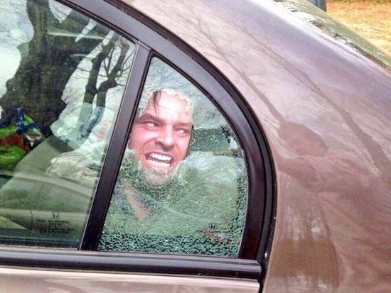 Picture of Jack Nicholson in The Shining put onto a broken window in a car.