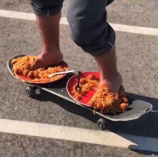 Skateboarding with plates of spaghetti for shoes.