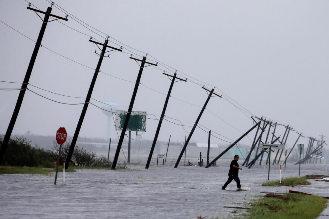 Phone poles slanted by Hurricane Harvey