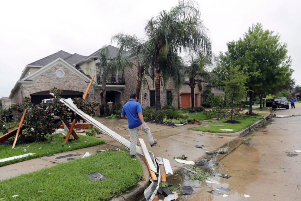 Fully intact house with some minor street damage after Hurricane Harvey