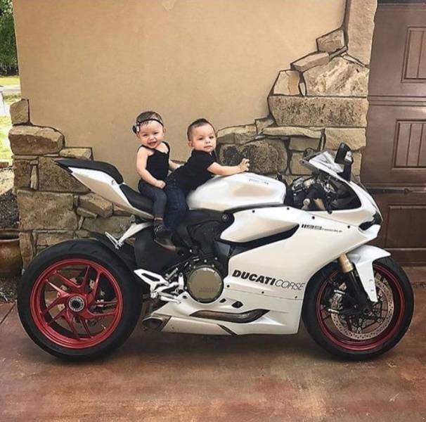 Kids on a Ducati motorcycle