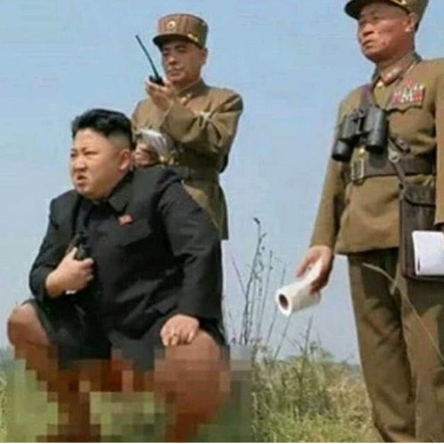 Kim Jung Un taking dump in the field with his men.