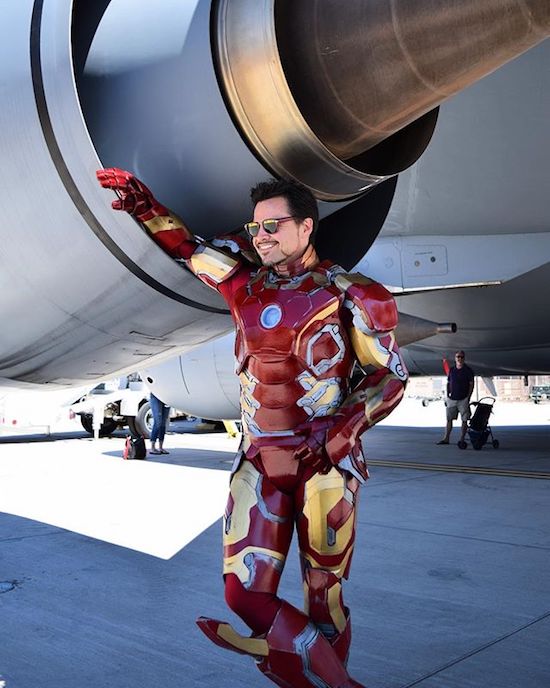 Ironman costume at the back of an airplane engine.