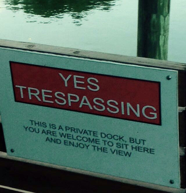 street sign - Yes Trespassing This Is A Private Dock, But You Are Welcome To Sit Here And Enjoy The View