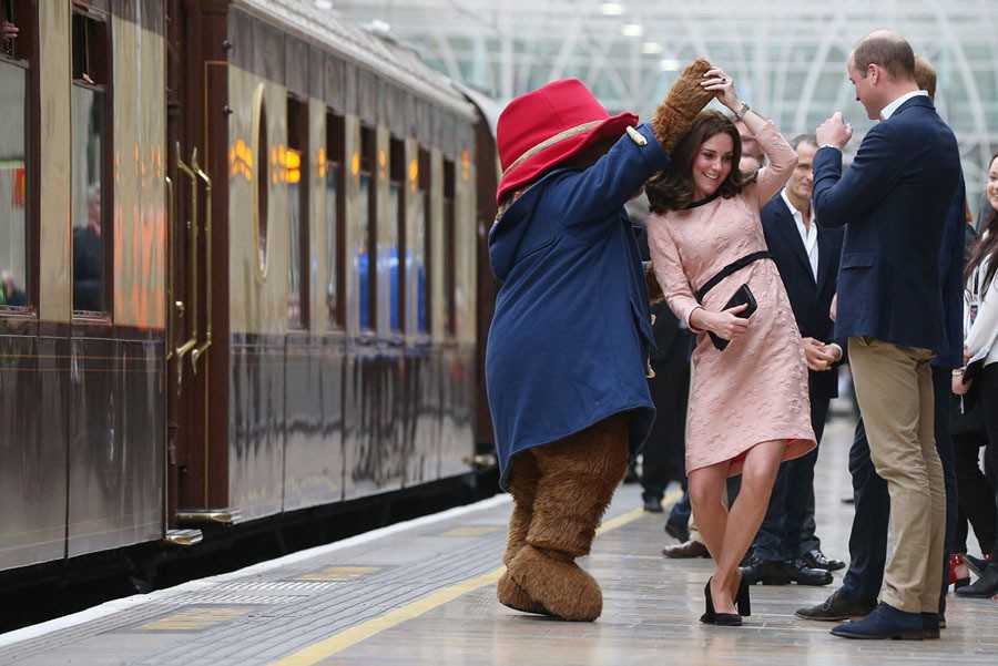 Catherine, Duchess of Cambridge, dances with Paddington Bear on platform 1 at Paddington Station as she meets the cast and crew from the forthcoming film Paddington 2 on October 16, 2017.