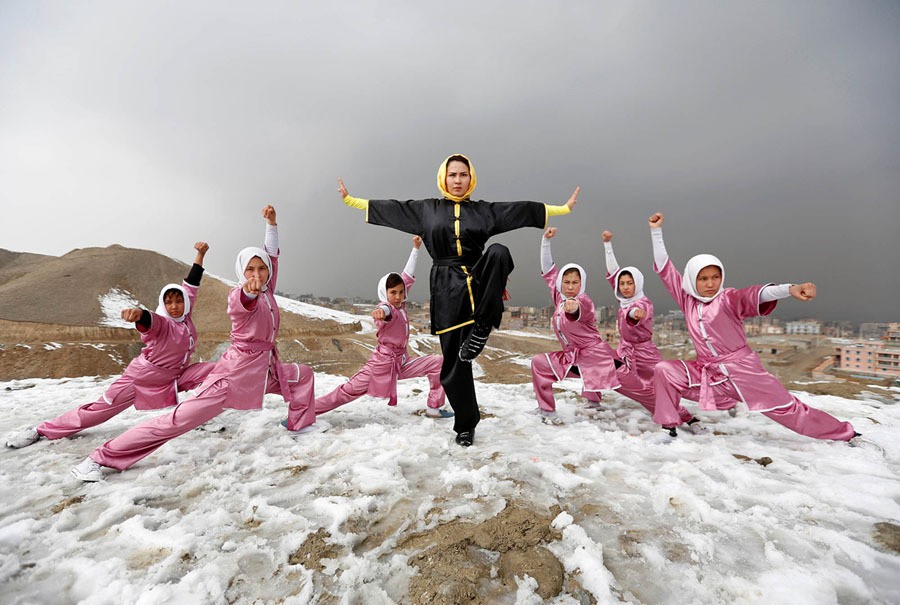 Sima Azimi, a trainer at the Shaolin Wushu club, poses with her students after an exercise on a hilltop in Kabul, Afghanistan, on January 29, 2017. Azimi, the 20-year-old leading the practice session, says Wushu teaches self-defense, but just as important, "it's really effective for body and soul." She learned the sport in Iran, where she won both a gold and bronze medal in competition. She has been teaching in Kabul for about a year, encouraged by her father, with whom she trains at the club's gym. "I am working with Afghan girls to strengthen their abilities and I love to see Afghan girls improve the way other girls have improved in the world," Shima said. “My ambition is to see my students take part in international matches and win medals for their country."