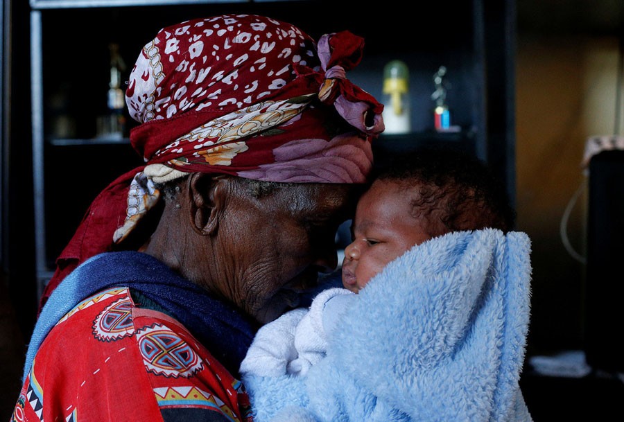 Thumekile Mthiyane, 90, who is known as "Gogo Mthiyane," looks after her 2-week-old great-grandson Lubanzi while his mother is at university, at their family home in KwaNdengezi, South Africa, on May 18, 2017. "Gogo" means grandmother in Zulu.