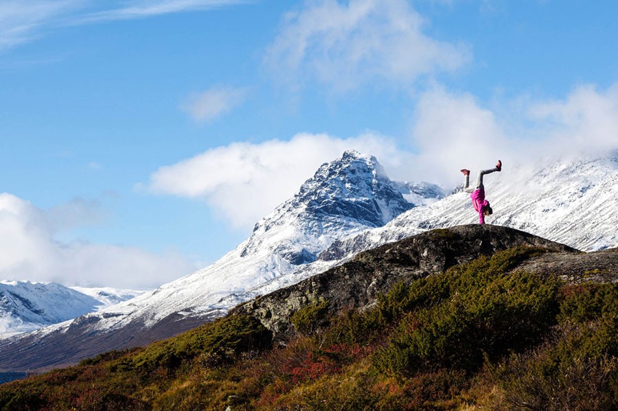 A girl stands on her hands near Vang, Norway.