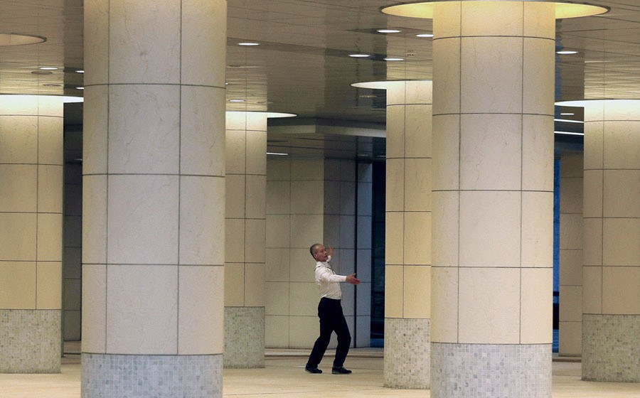 A man practices ballroom dancing during a lunch break in Tokyo's business district on January 11, 2017.