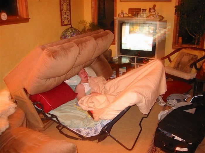 person stuck in a sofa bed