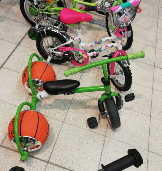 funny looking bicycle with basketballs for tires