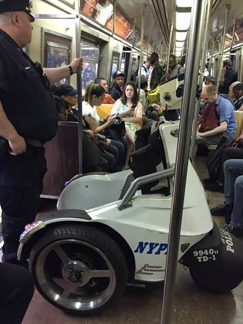 police man with dorky segway on the subway
