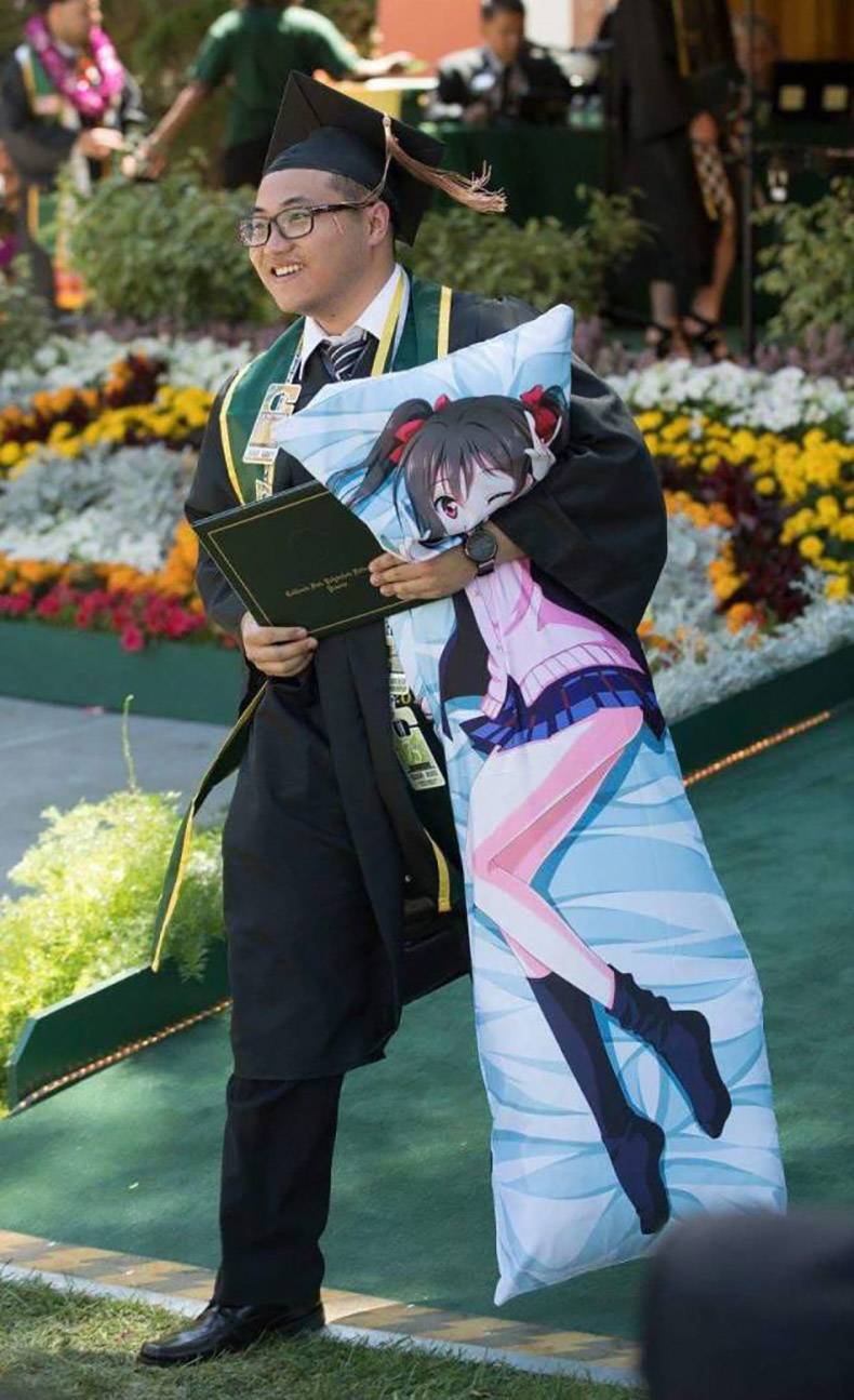 man graduating with his Waifu