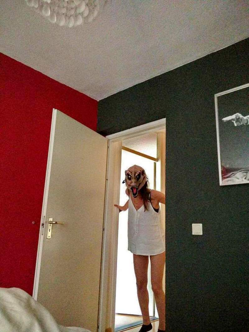 girl with scary mask at the doorway