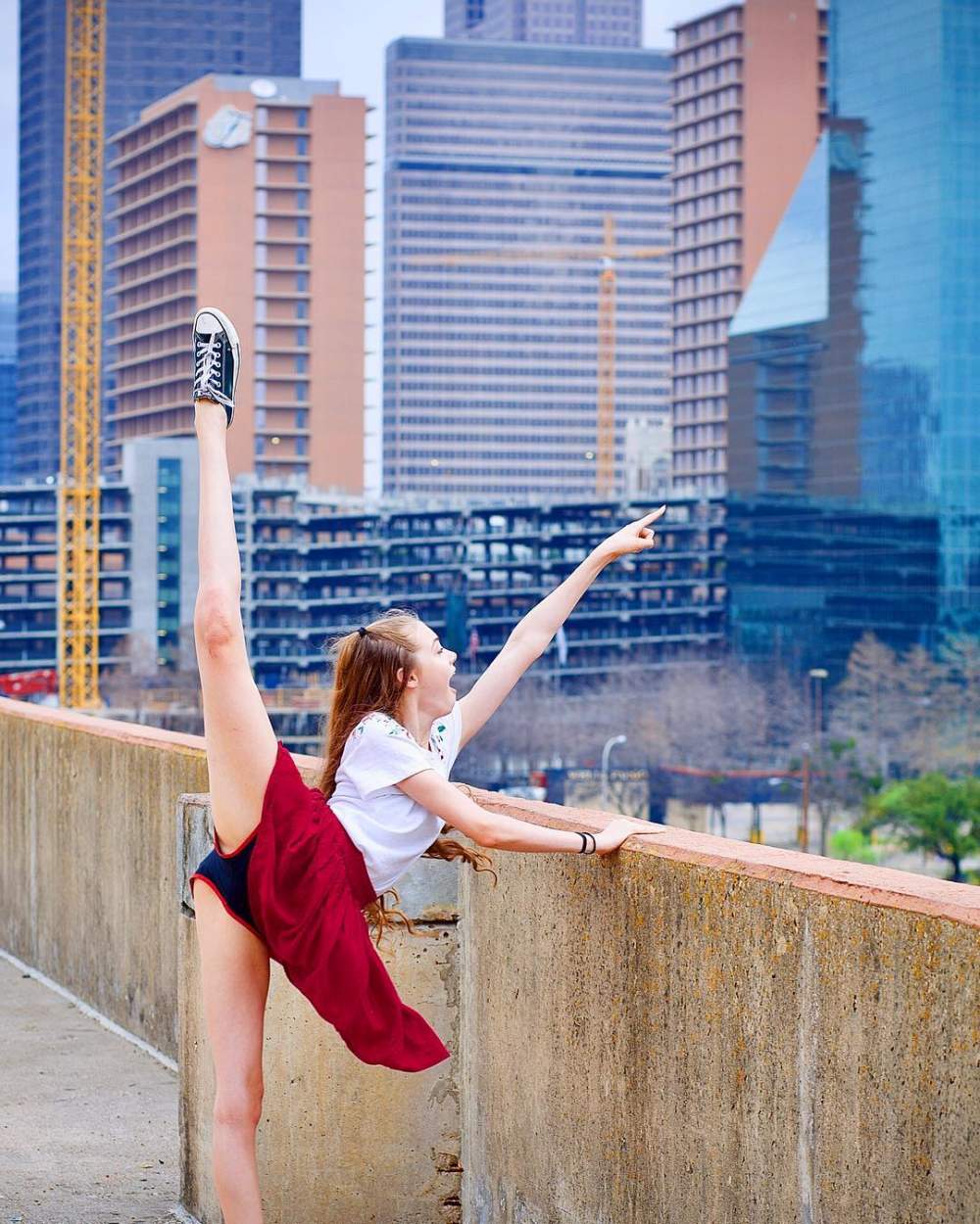 girl doing split and pointing