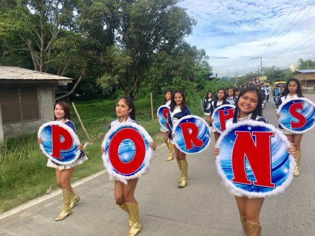 girls holding letters that seem to spell porn