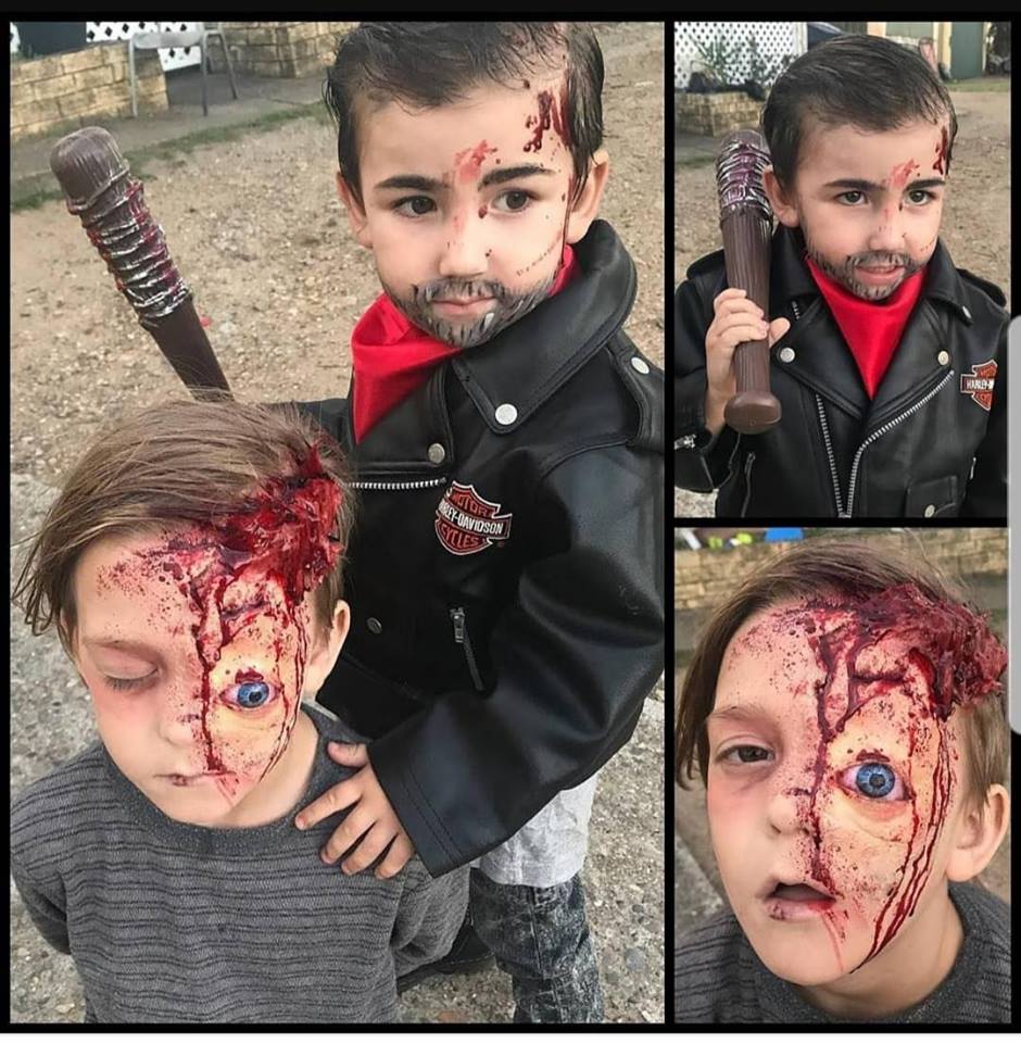 amazing makeup on kids posing as Nigel from The Walking Dead