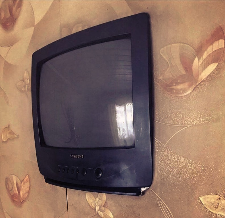 cool pic of an old tv placed inside a wall like a flat screen