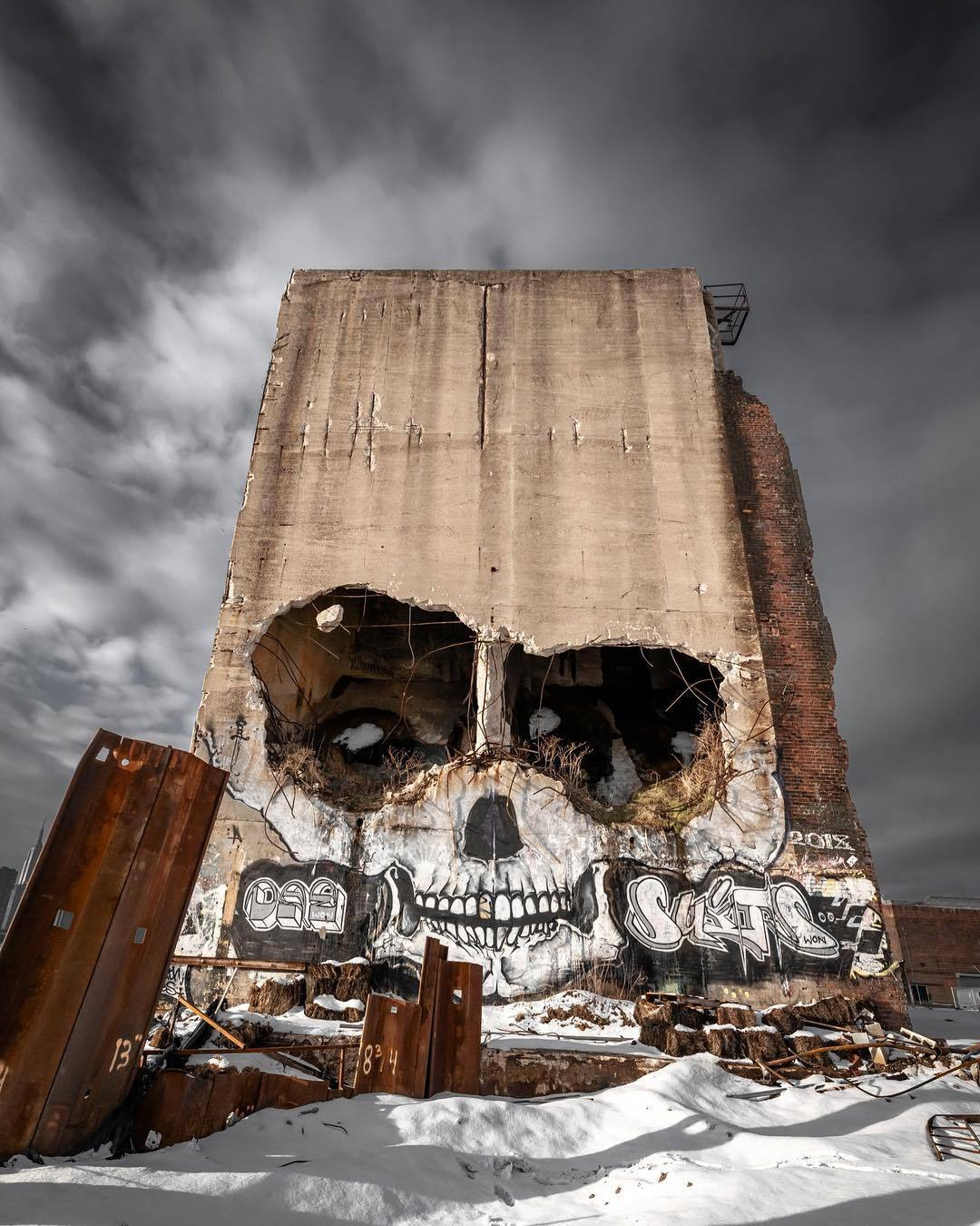 remarkable image of a crumbling wall with skull graffiti