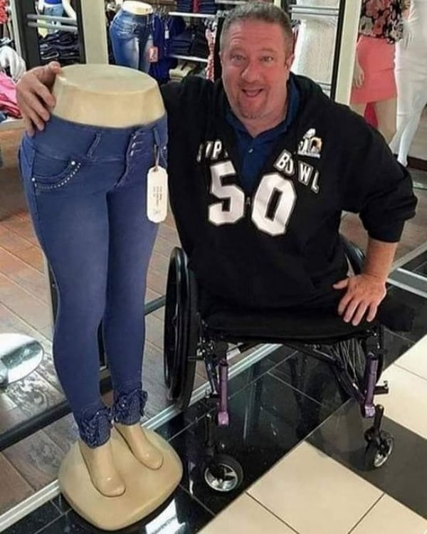 remarkable image of a man with no legs posing with a mannequin with no upper body