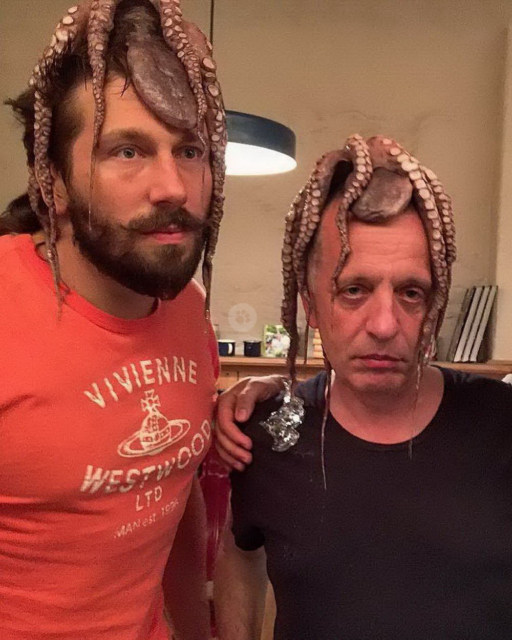 remarkable image of men with squids on their heads