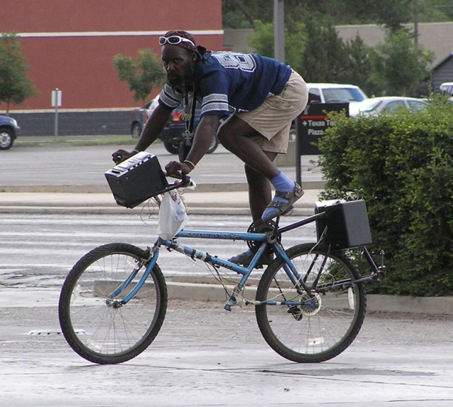 random pic black guy on bike