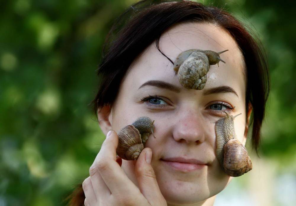 girl with snails on her face