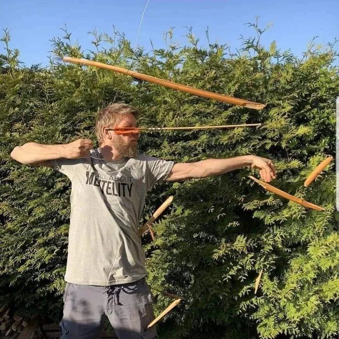 bow and arrow exploding in man's face