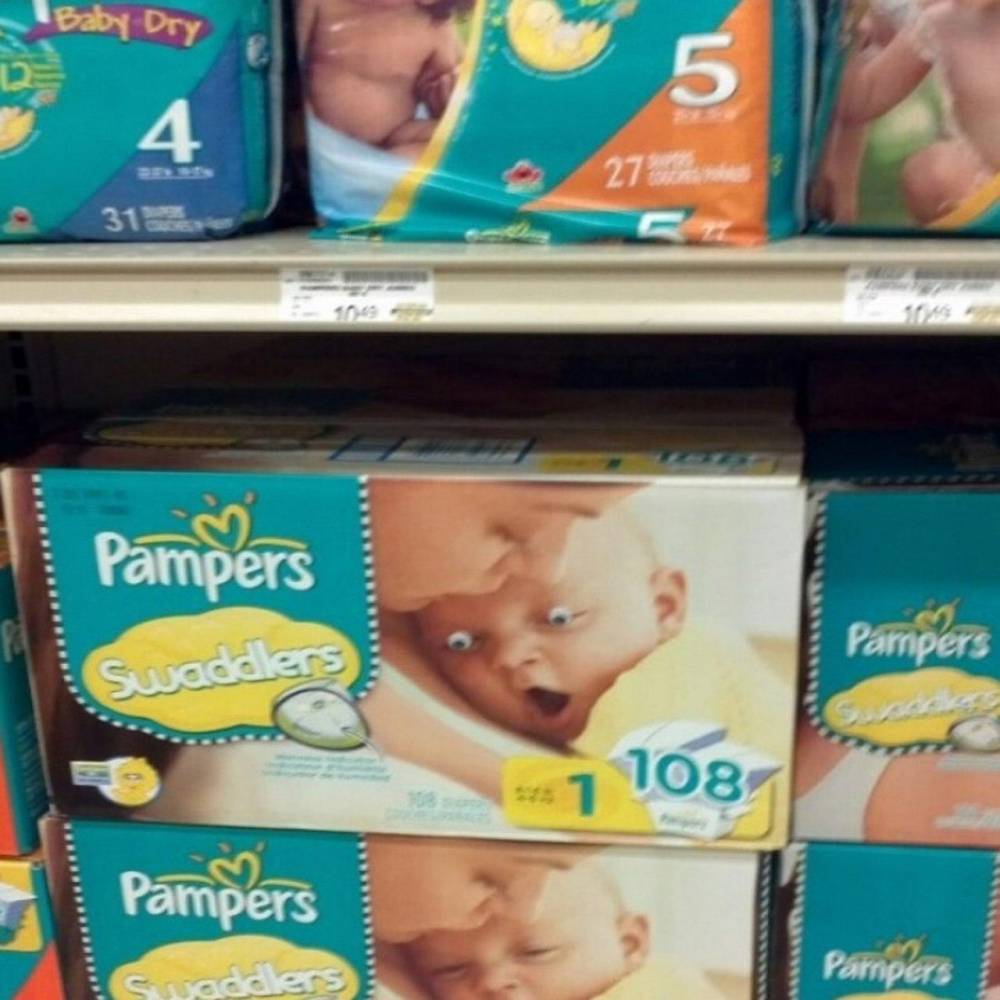 pampers with googly eyes on baby's face