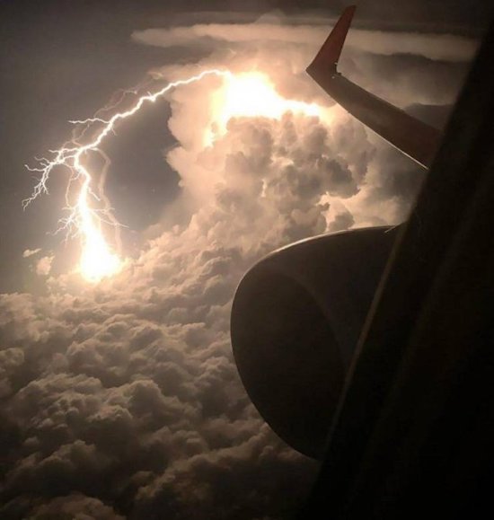 lightening outside of a plane window