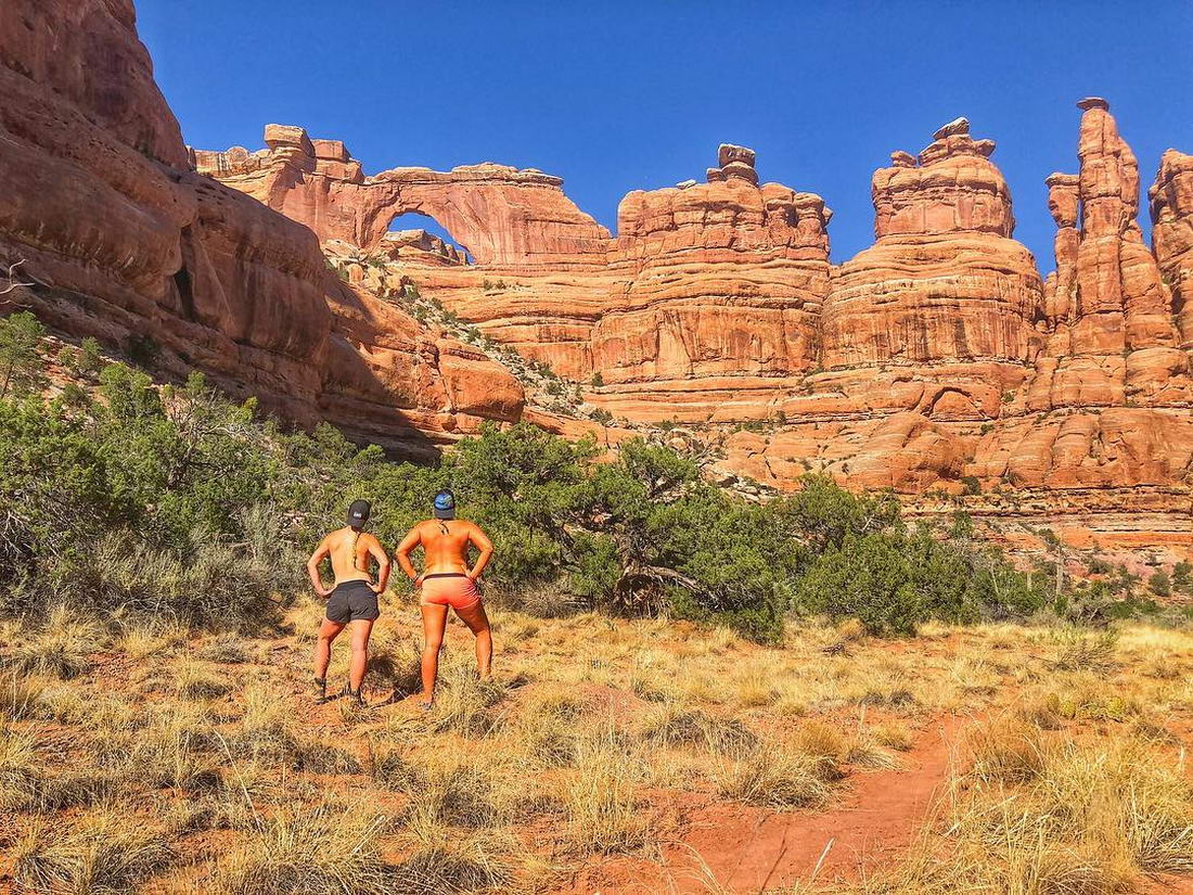 Girls Posing "Topless" Against the Backdrop of Scenic Places