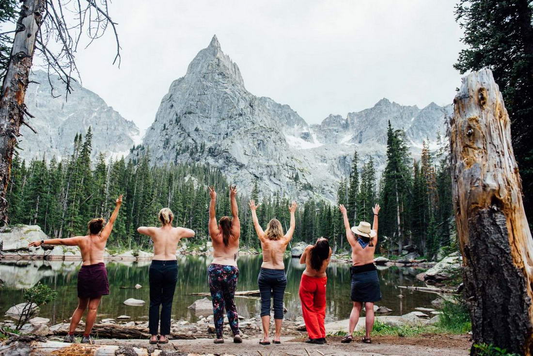 Girls Posing "Topless" Against the Backdrop of Scenic Places