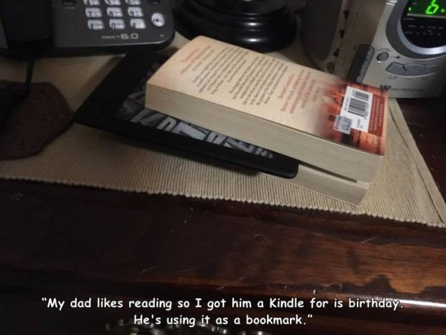 space bar - . "My dad reading so I got him a Kindle for is birthday. He's using it as a bookmark."
