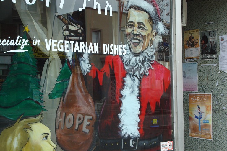 Toronto Ethiopian restaurant gets into the Christmas spirit with an Obama painting on the front window