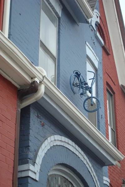 Weird, downtown Toronto house has a bike hanging off it if, for reasons unknown
