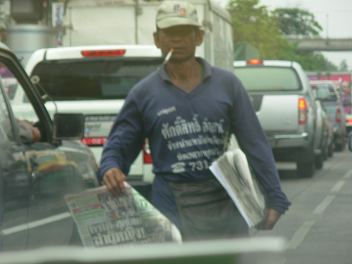 Man sees that the newspaper business if faltering and takes the message out to the street