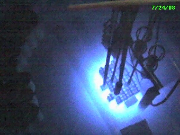 A picture from the inside of the University of Maryland nuclear reactor facility. This is glowing Uranium-235 fuel rods submerged in a tank of water.