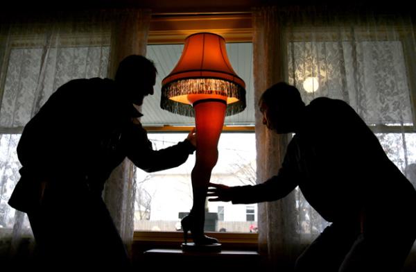  Russ Twoey, 33, left, and his father Gary Twoey, 56, right, touch the original Leg Lamp during their tour of the house that was made famous in the film "A Christmas Story" on Friday, Nov. 28, 2008 in Cleveland, Ohio. (AP Photo//The Plain Dealer, Lisa DeJong) 